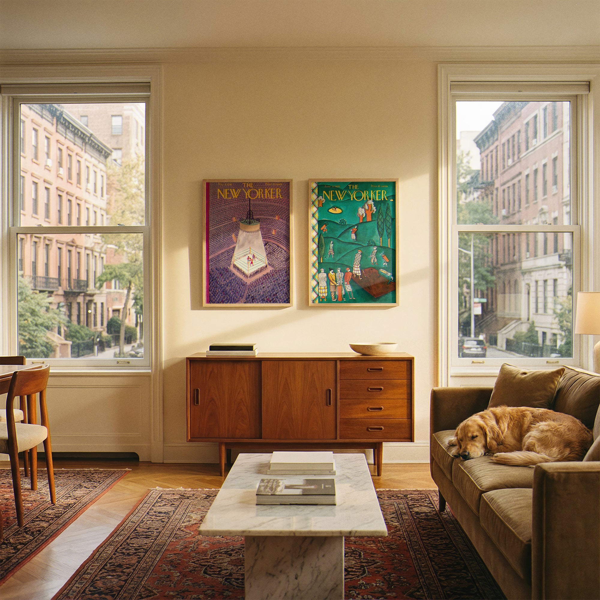 Living room with a dog on a couch, wooden sideboard, and New Yorker posters.